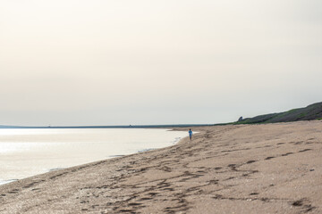 Human footprint on sand summer beach background with copyspace