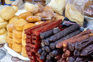 A stall at the fair with cheese and other farm products. 