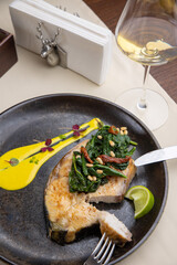 salmon steak on a plate, in a restaurant
