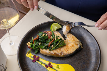salmon steak on a plate, in a restaurant
