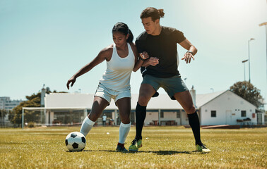 Man, woman and playing soccer on grass park, stadium field and nature environment in competition match, game and challenge. Fitness friends, sports people and football players in soccer ball training - Powered by Adobe