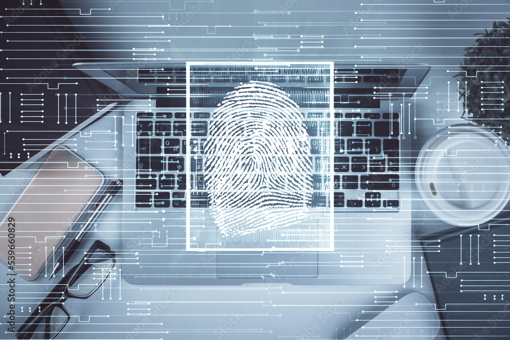 Aufkleber finger print over computer on the desktop background. top view. double exposure. concept of securiti