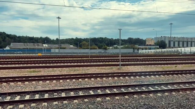 view of railroad from window of moving train. Industrial area of Moscow city. High quality 4k footage