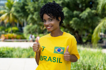 Pretty brazilian female football fan with yellow jersey