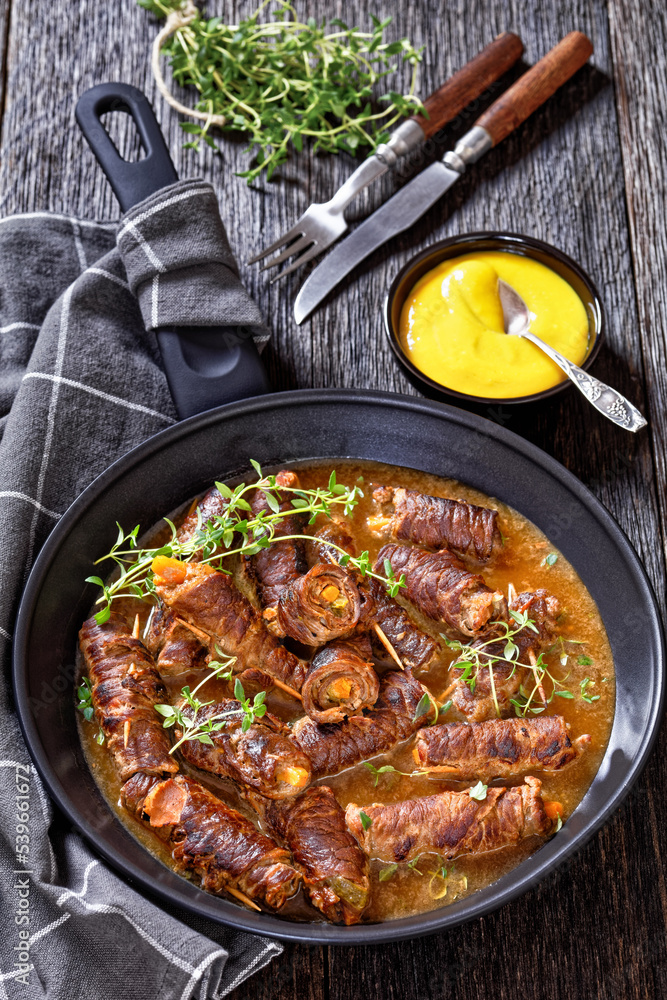 Sticker german beef rouladen in thick gravy on pan