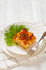 Scalloped Chicken Casserole topped with croutons