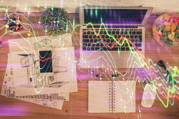 Multi exposure of financial chart drawing over table background with computer. Concept of research. Top view.