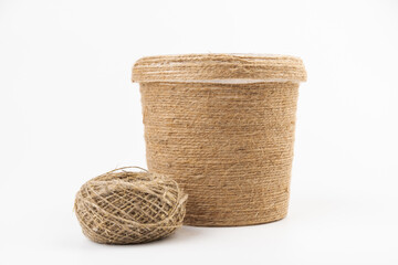 close-up of brown jute twine for DIY and gift wrapping, isolated on white background, concept of zero waste or sustainable lifestyle.