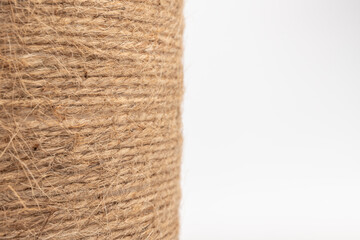 close-up of brown jute twine for DIY and gift wrapping, isolated on white background, concept of zero waste or sustainable lifestyle.