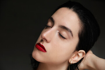 Close-up of young woman with calm face expression. Mental issues and health.