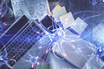 Neuron hologram drawings over computer on the desktop background. Top view. Multi exposure. Concept of education.