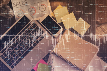 Financial market graph and top view computer on the desktop background. Multi exposure. Investment concept.