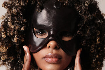 Portrait of black young woman with black mask on her face. Horizontal mock-up.
