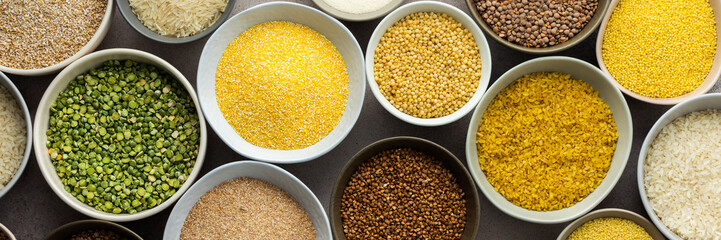 Various grain cereals in bowls banner, top view