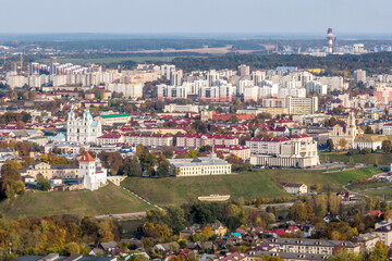 aerial panoramic view from height of a multi-storey residential complex and urban development in autumn day