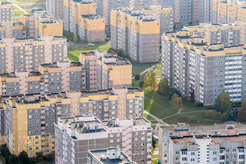 Fototapeta na wymiar aerial panoramic view from height of a multi-storey residential complex and urban development in autumn day