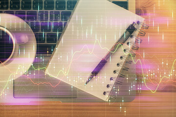 Multi exposure of forex chart drawing and work table top veiw. Concept of financial analysis.
