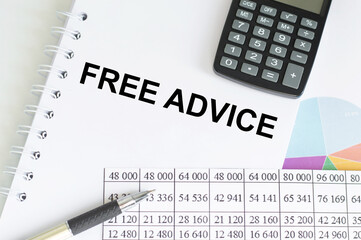 FREE ADVICE text on paper with calculator, notepad,pen with graph