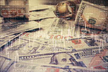 Multi exposure of forex chart drawing over us dollars bill background. Concept of financial success markets.