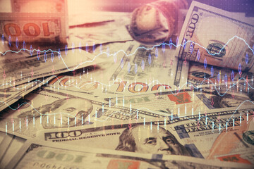 Multi exposure of forex chart drawing over us dollars bill background. Concept of financial success markets.