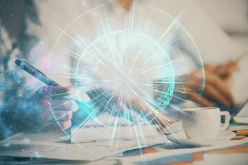 Double exposure of business theme drawing over people taking notes background. Concept of financial world