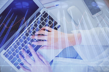 Double exposure of woman hands working on computer and forex chart hologram drawing. Top View. Financial analysis concept.