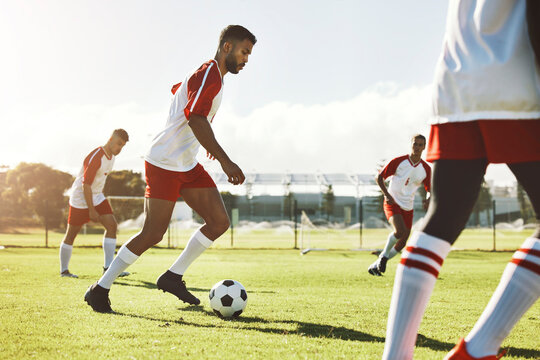 Team sports game, soccer and teamwork of men busy with football collaboration and workout. Fitness, training and healthy exercise of a healthy athlete ground with fast energy running with a ball
