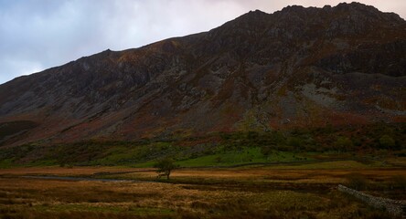 Red rocky mountain near the Maes Caradoc roadside position on a minor valley road