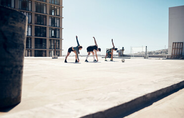 Soccer, sports and fitness with a team stretching on a rooftop court before a game or match...