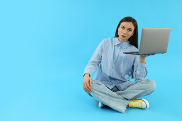 Concept of people, young woman on blue background