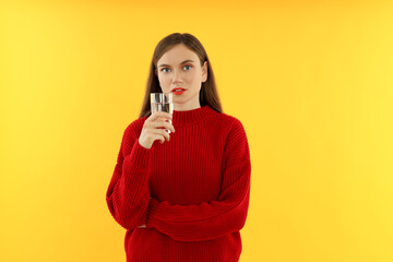 Concept of people, young woman on yellow background