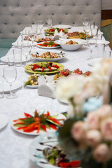 sandwiches and snacks on a table with a white table, a festive table