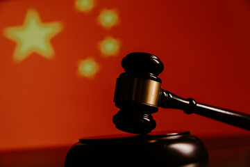 Wooden judge gavel against Germany flag