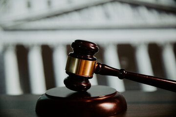 Judge gavel on a wooden table close-up. Law and justice concept