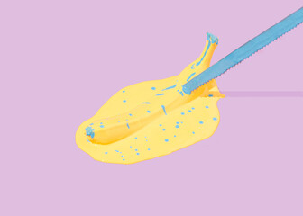 A knife stuck in a banana, which lies in yellow and blue. Minimal creative composition..