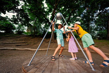 Three kids rides on the playground. Centrifuge, swing for children.