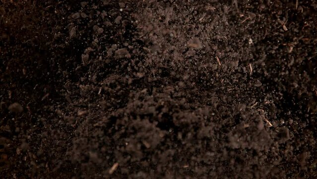 Super Slow Motion Shot of Exploding Soil Towards Camera at 1000fps.