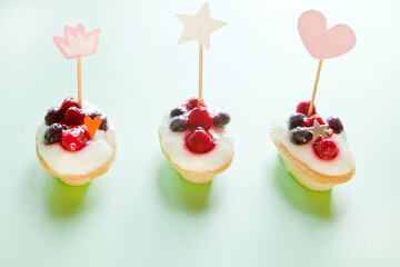 mini cakes with berries and cottage. party decoration with hearts. Valentine's Day gift for holiday