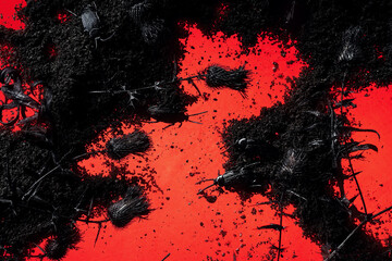 Scary prickly plants with bugs on black ground above glowing red background