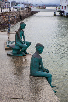 Santander, Cantabria, Spain - January 25, 2019: Los Raqueros Bay Sculptures by spanish artist Jose Cobo in Santander. Detail of statue of the raqueros in spanish port Santander