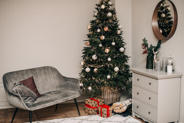 Christmas background with Christmas tree, sofa, fireplace and gifts.
