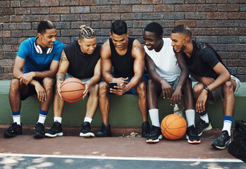 Basketball friends, rest together with phone and relax watch a funny video on smartphone after...