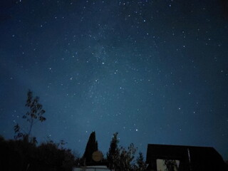 Bright night starry sky in the village
