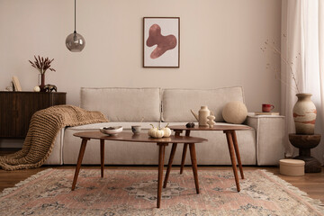 Domestic and cozy interior of living room with mock up poster frame, corduroy sofa, wooden coffee...
