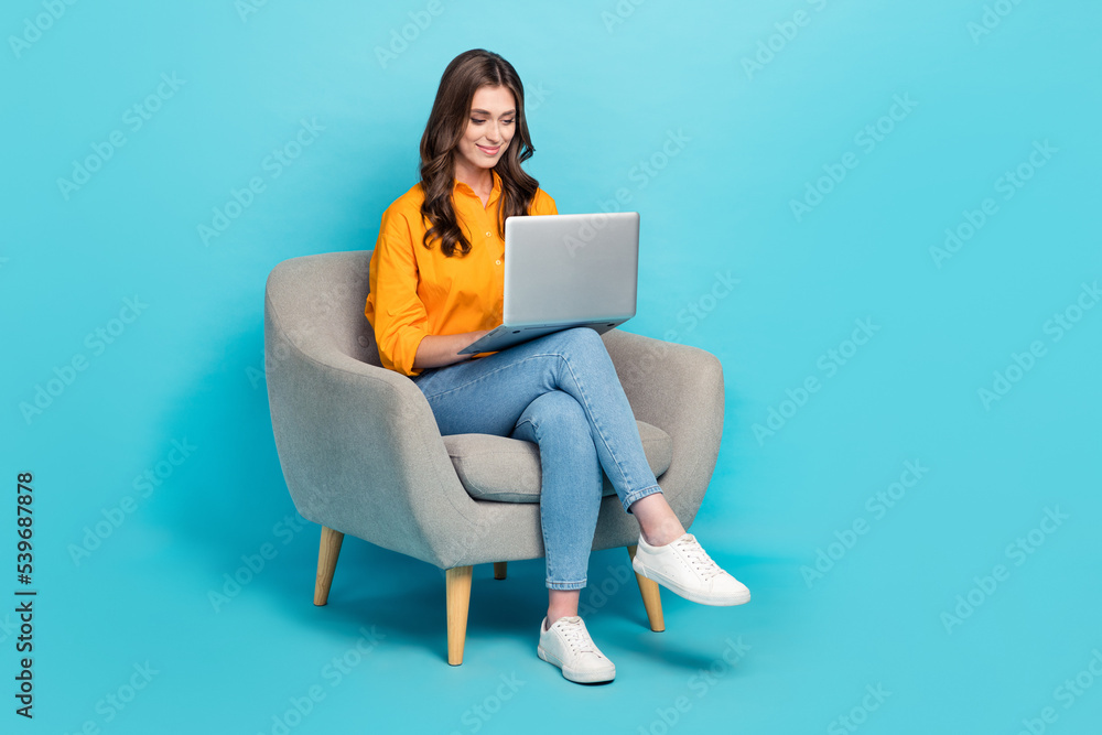 Poster full size photo of pretty positive girl sit use netbook write typing email isolated on blue color ba