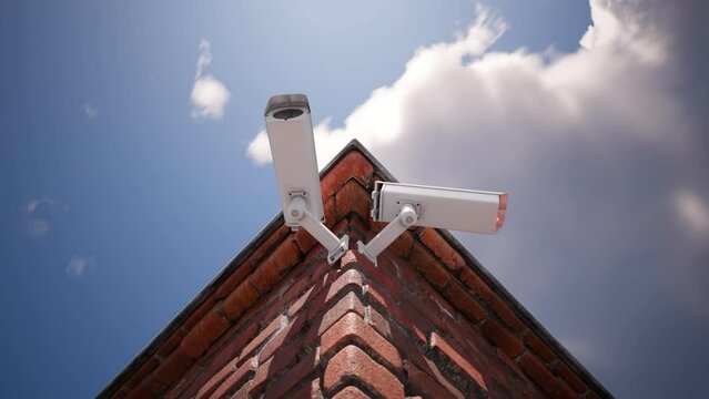 Two security cameras watching the neighborhood from the building corner. 4K HD