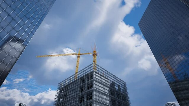 High skyscraper being built by construction cranes in a one day timelapse. 4K HD