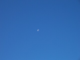 Morning moon in the blue sky