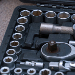 A set of socket wrenches.Locksmith tools in a box. A tool for car repair. Selective focus