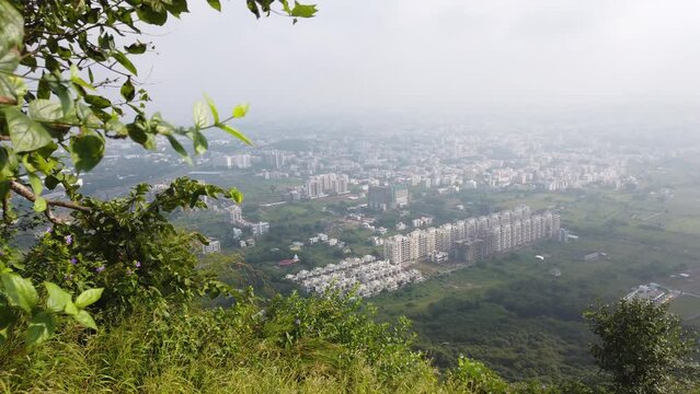 Pandav Leni Hills With Nashik Cityscape View Against Overcast Sky In Maharashtra, India. Sideways Shot